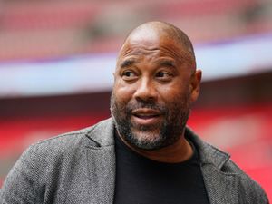 Former Liverpool winger John Barnes looks on