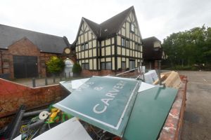 A skip outside the pub that closed in July