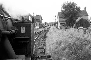A loco approaches Ketley level crossing over the A5 and the station just beyond in the early 1960s.