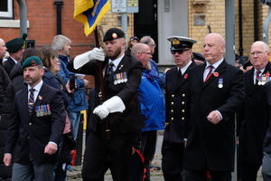 Royal British Legion standard bearer Rhodri Evans with other servicepeople and veterans. Pic by Andy Compton