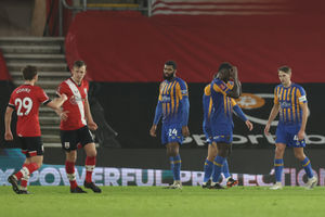 Players of Shrewsbury Town react after James Ward-Prowse of Southampton scores a goal to make it 2-0.