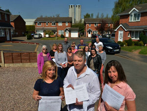 Marie Jarvis, councillor Steve Jones, and Sarah Nicholls, with other residents complaining about the huge silos