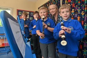 Music teacher Caroline Kessel-Fell will pupils (left to right) Sidney, Charlie, Blake and Oscar