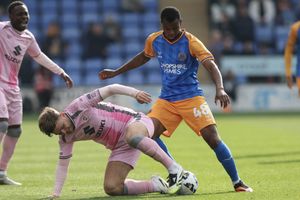 Bradley Ihionvien of Shrewsbury Town and Laurence Maguire of Milton Keynes Dons