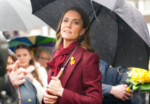 The Princess of Wales shelters from rain under a umbrella whilst meeting members of the public during a visit to the Hanging Gardens. Photo: Ben Birchall/PA Wire