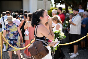 Mourners pay their respect at the wake of Diogo Jota being held at Sao Cosme Chapel in the town of Gondomar near Porto