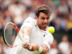 Cameron Norrie hits a backhand at Wimbledon