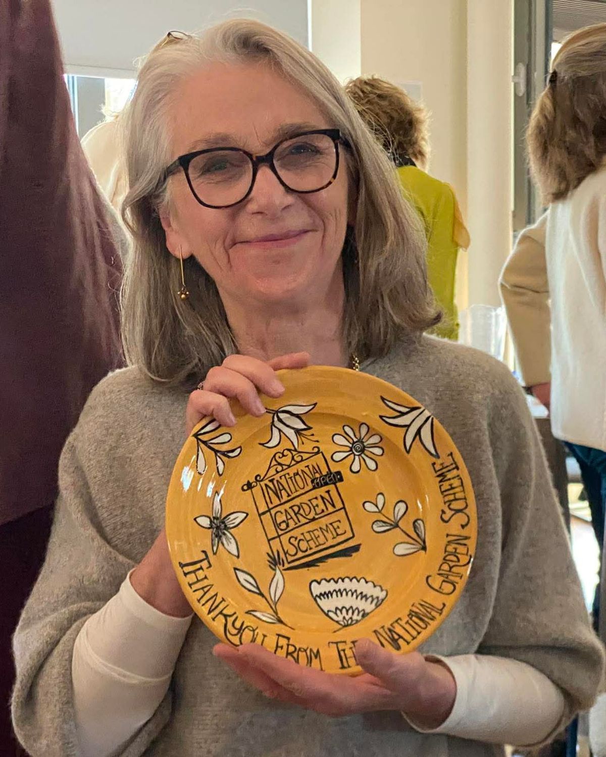 A National Garden Scheme volunteer who has completed 25 years service has been given a special award