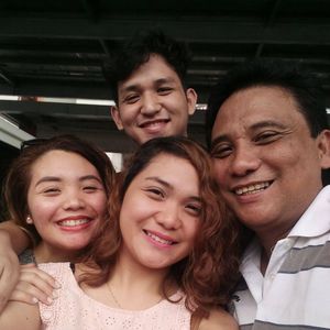 April (centre) with her dad and family