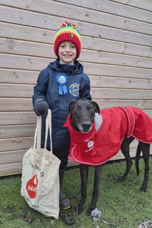 7 year old Freddy with his greyhound, Wizz, who donated life saving blood during the recent Pet Blood Bank visit