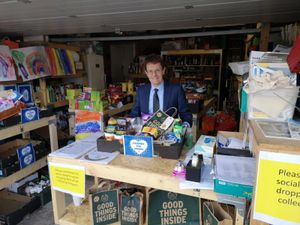 Andy Street helps out with packing