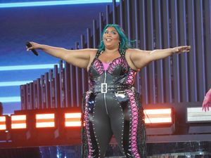 Supporting image for story: Lizzo ‘so moved’ by fans who helped her reach heights of Glastonbury main stage