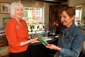  Gill Howard shows some of her crafted jewellery to Marion Drinkwater