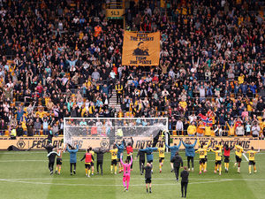 Wolves players and fans celebrate victory against Spurs (Photo by Jack Thomas - WWFC/Wolves via Getty Images)
