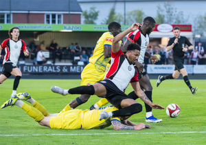 Action from Hednesford Town against Vauxhall Motors (Jim Wall)