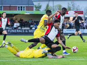 Action from Hednesford Town against Vauxhall Motors (Jim Wall)