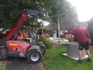 Workers from SAMCO help install the plinth in the grounds of Bridgnorth Castle