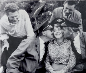 Keith and Christine Pritchard on their wedding day, with the three postmen
