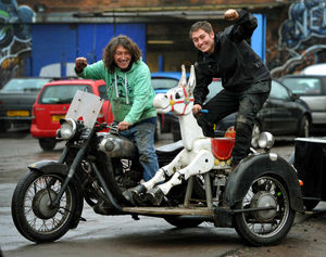 Neil Turner and son Eden on a bike with a donkey sidecar