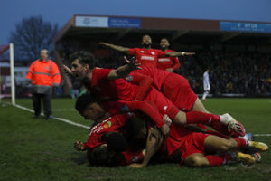 Kidderminster Harriers' Sam Austin (bottom) is congratulated by his team mates 
