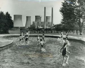 Just the place to enjoy the sunny weather, in the paddling pool at Ravenhill recreation ground at Brereton near Rugeley, in July 1964. 