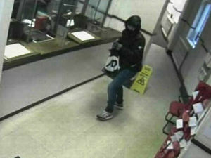 Supporting image for story: Caught on camera: Armed raider strikes at bank