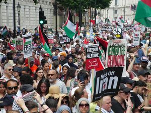 People take part in a march organised by the Palestine Solidarity Campaign