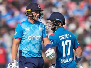 England’s Ben Duckett, right, and Joe Root shares a light moment