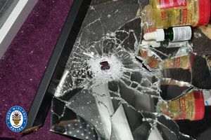 Image of bullet hole in mirror