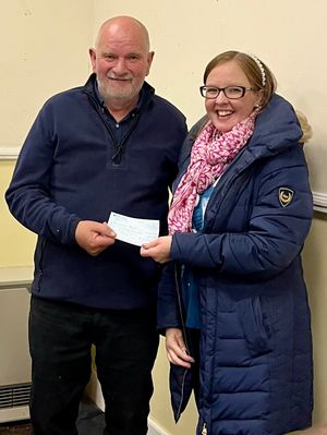 Supporting image for story: Powys choir presents cheque to local charity after successful fundraising event