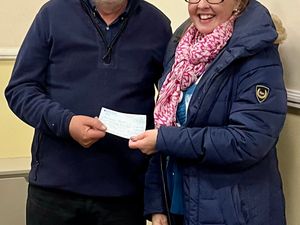 Supporting image for story: Powys choir presents cheque to local charity after successful fundraising event