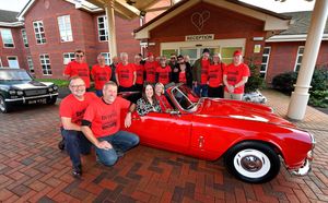 A Triumph Spitfire was carefully restored, and has been sold to raise funds for Severn Hospice.
Tracie Harrison, director of income generation from the hospice, takes to the driving seat