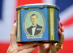 The Duke of Edinburgh, Prince Phillip, is seen clearly on the side of the caddy