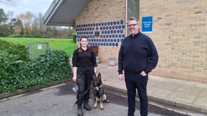 From left, Sergeant Vicki Hallett, police dog in training PD Solo, and PCC John Campion outside the police dog training centre.