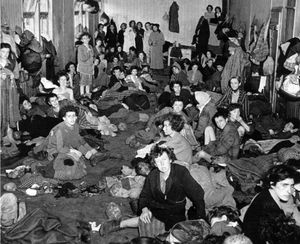 Female inmates at Bergen-Belsen concentration camp, many of them sick and dying of typhus and starvation