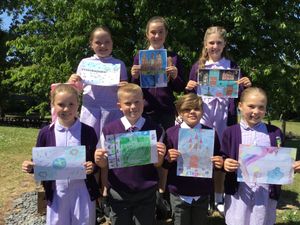 Pupils at St Joseph’s Catholic Primary School in Lichfield with their artwork.
