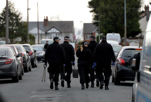 A police search team on Greenhill Road