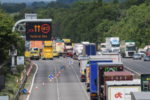 Traffic snakes past the crash scene. Photo: SnapperSK