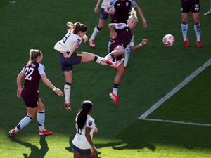 Everton's Maren Mjelde beats Villa's Rachel Daly to the ball to score her team's first goal during the Barclays Women's Super League match at Villa Park on Sunday (Photo by Morgan Harlow/Getty Images)