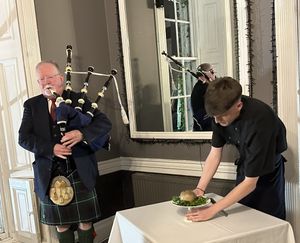 Andy the piper with the Haggis and haggis wrangler