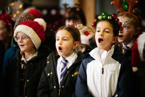 Year Three and Year Four pupils from Lawley Village Academy singing carols for care home residents
