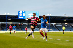 Tom Bloxham of Shrewsbury Town and Lee Brown of Portsmouth. (AMA)
