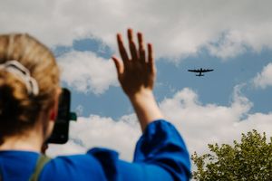 People waved, cheered and took photos and videos to enjoy the occasion
