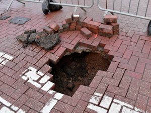 Supporting image for story: Road closed in Wolverhampton after 'three-foot-deep, three-foot-wide sinkhole' appears on city street
