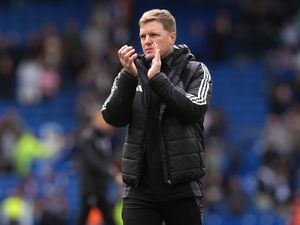 Newcastle head coach Eddie Howe applauds the fans after the final whistle at Brighton