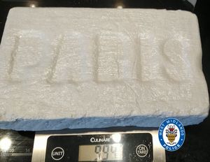 A block of cocaine with 'Paris' pressed into it