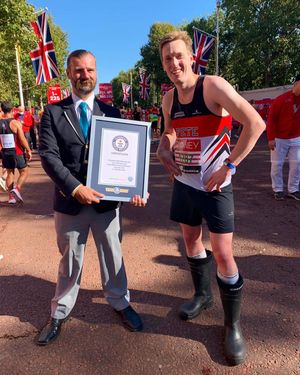Peter with a Guinness representative and his official world record certificate