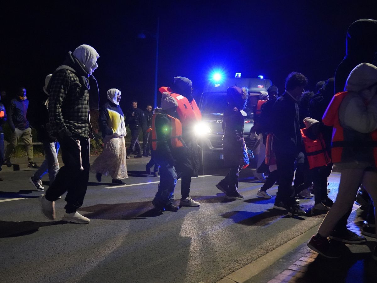 Riot police stop migrants from reaching beach in French town