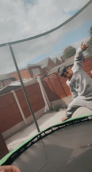 Abdul Ahad Haroon playing on a trampoline 
