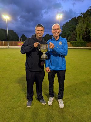 Trophy time for Ifton captain Dickie Jones with Premier competition secretary Rob Burroughs